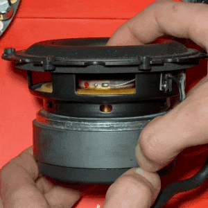 gently pushing speaker to feel for damage